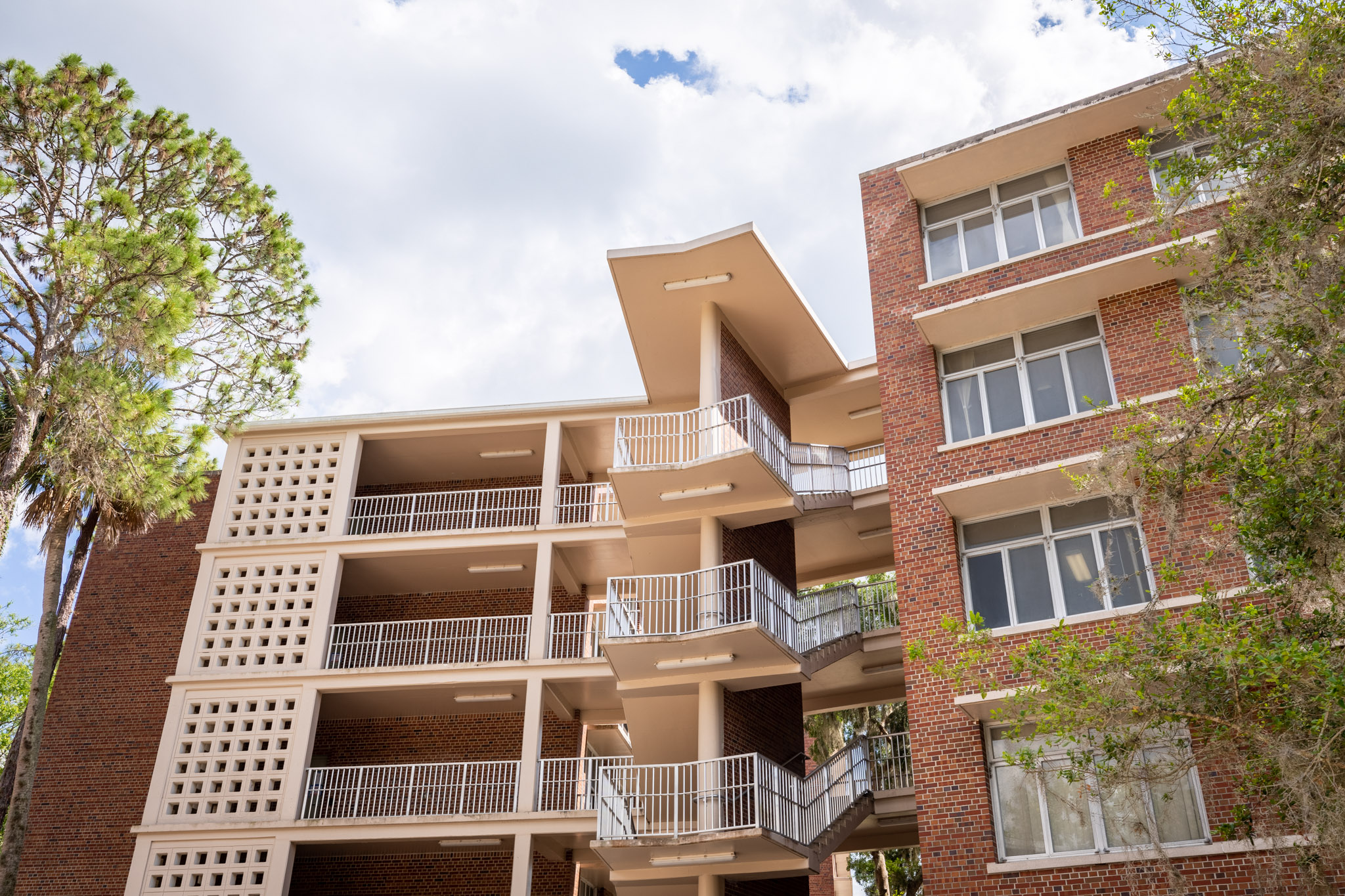 the brick exterior of Simpson hall during a sunny day in Florida.