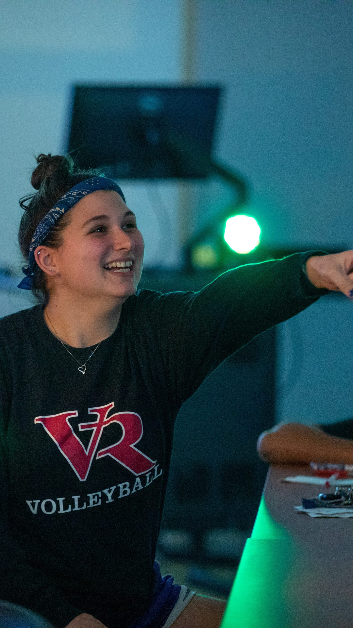 A female student excitedly points to her friend.