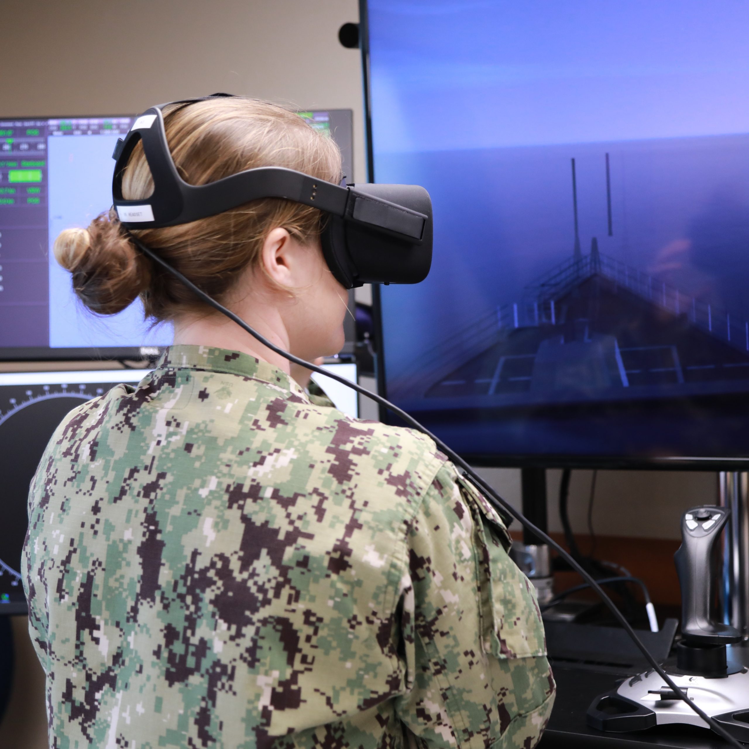 A student controls a simulated Navy Vessel.