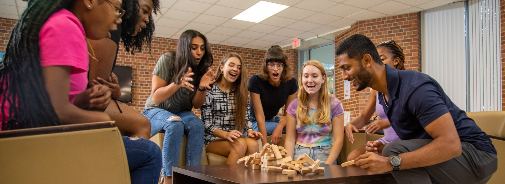 Students play Jenga in the Graham Hall common area.