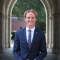 Professional headshot of Stephen Baradon in the Sledd Archway.