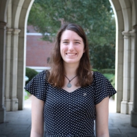 Professional headshot of Camille in the Sledd Archway.