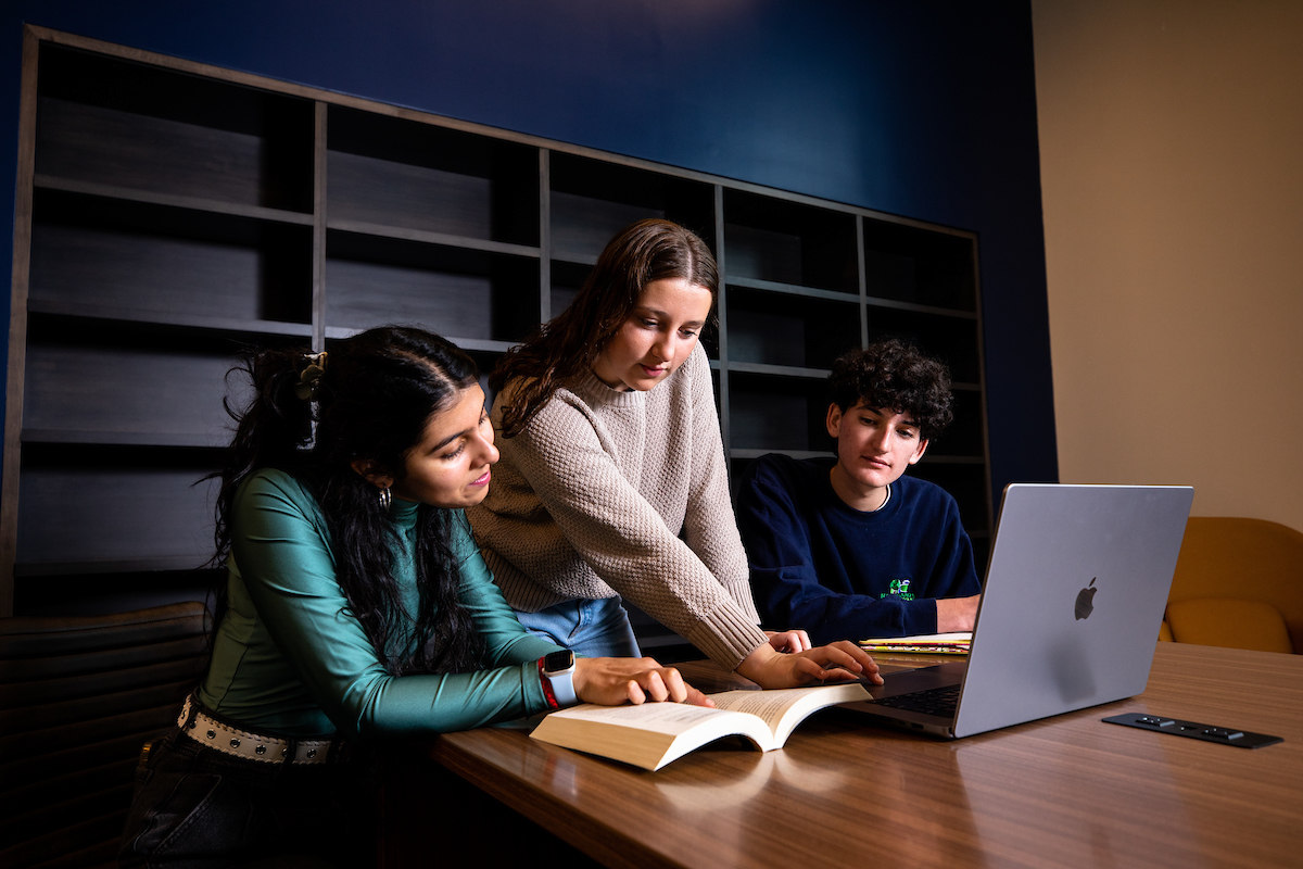 Three students study together