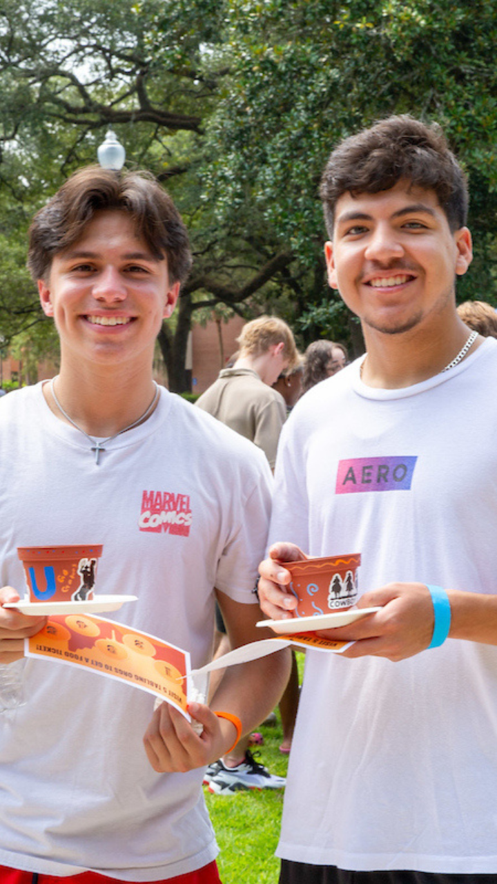 Two innovation academy students students join festivities on the plaza of the americas.