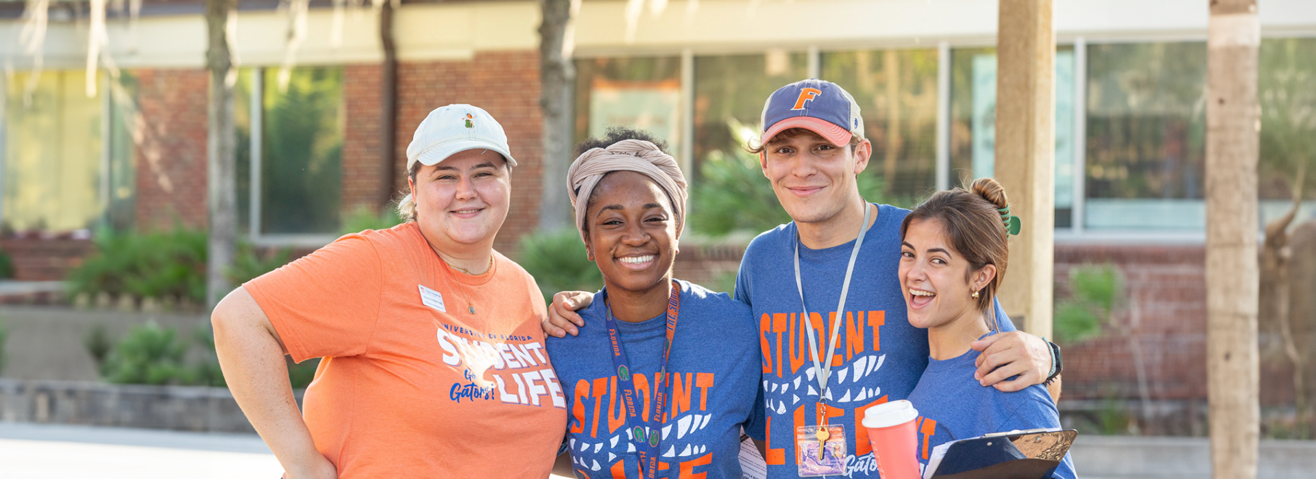 A group of move-in volunteers standing together and smiling brightly.