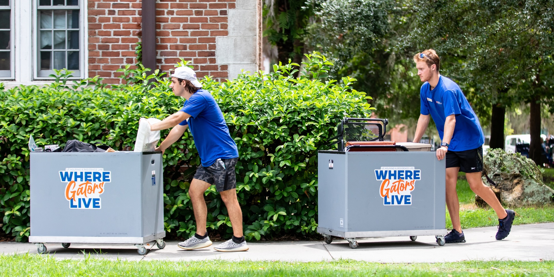 Two student workers push Move-In carts